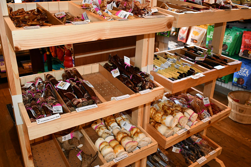 A display case filled with lots of different types of donuts.